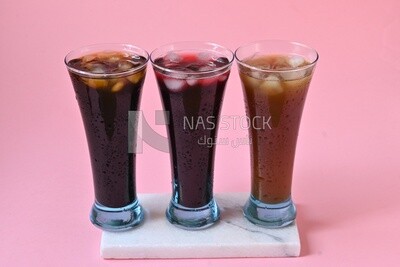 Three cups of Arabian juice served in the holy month of Ramadan, carob, hibiscus, Ramadan drinks, Ramadan Juices