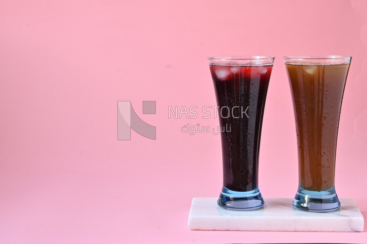 Two cups of Arabian juice served in the holy month of Ramadan, carob, hibiscus, Ramadan drinks, Ramadan Juices