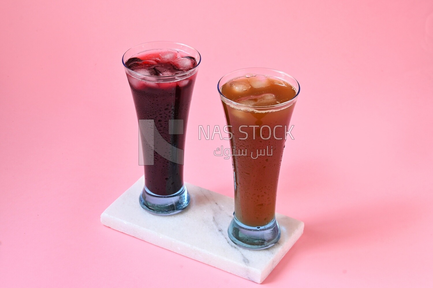 Two cups of Arabian juice served in the holy month of Ramadan, carob, hibiscus, Ramadan drinks, Ramadan Juices