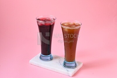 Two cups of Arabian juice served in the holy month of Ramadan, carob, hibiscus, Ramadan drinks, Ramadan Juices