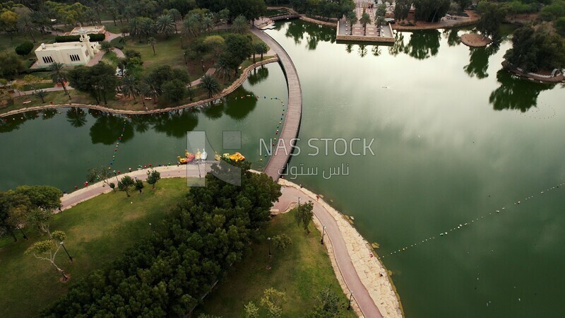 drone footage of Peace Park Lake in Riyadh, Saudi Arabia, tourist attractions in Riyadh, tourism in Saudi Arabia, natural view, famous Riyadh landmarks.4K