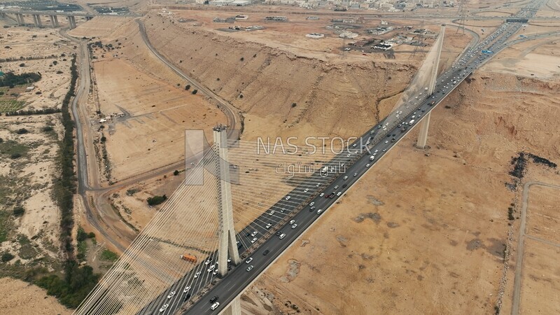Drone footage of the suspension bridge in Riyadh, Saudi Arabia, Wadi Laban Bridge, architecture, traffic and cars, famous Riyadh landmarks.HD