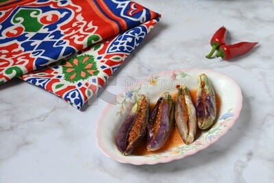 Plate of Pickled eggplant with sauce in it, Egyptian pickles, Arabic restaurants