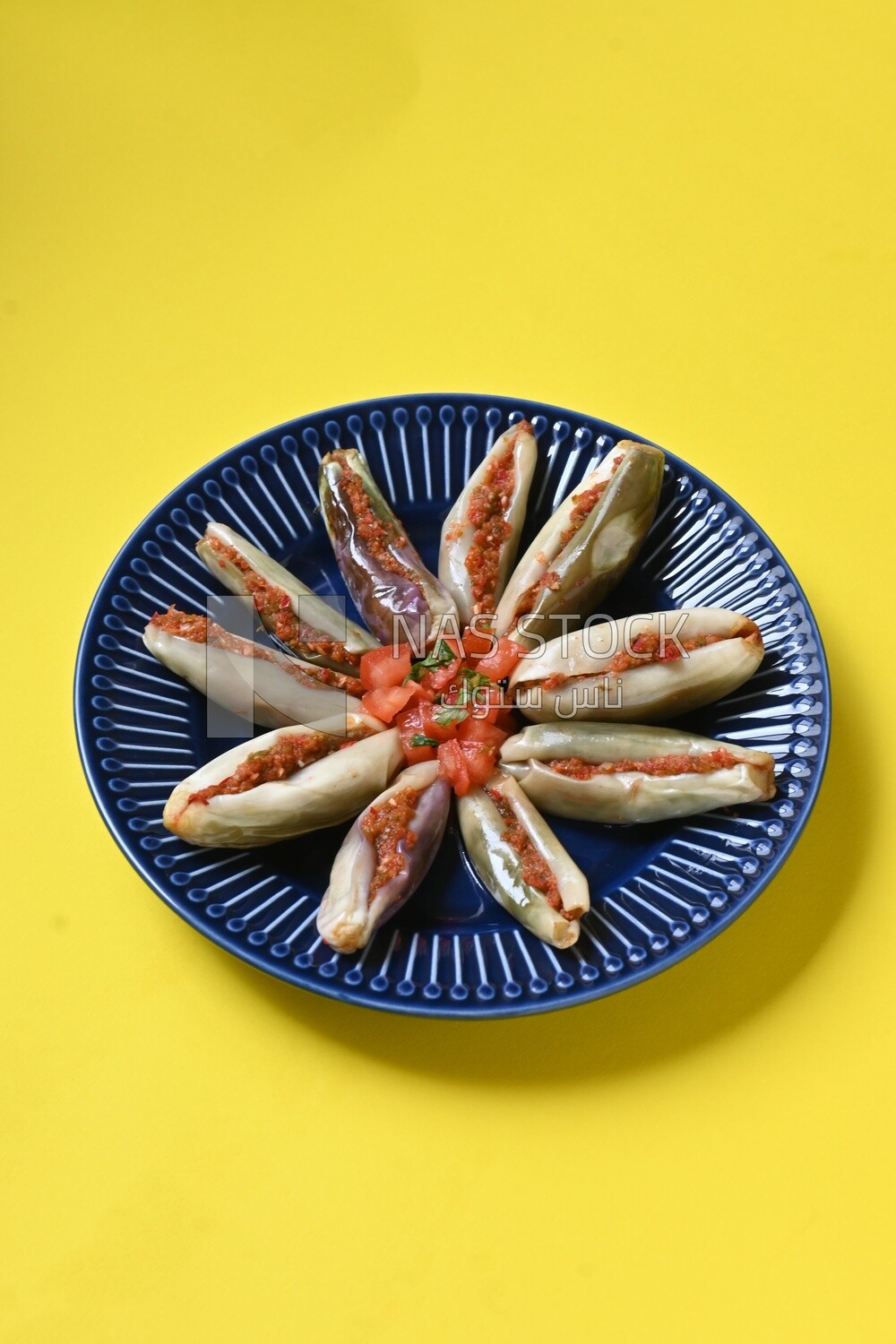 Plate of Pickled eggplant with sauce in it, Egyptian pickles, Arabic restaurants