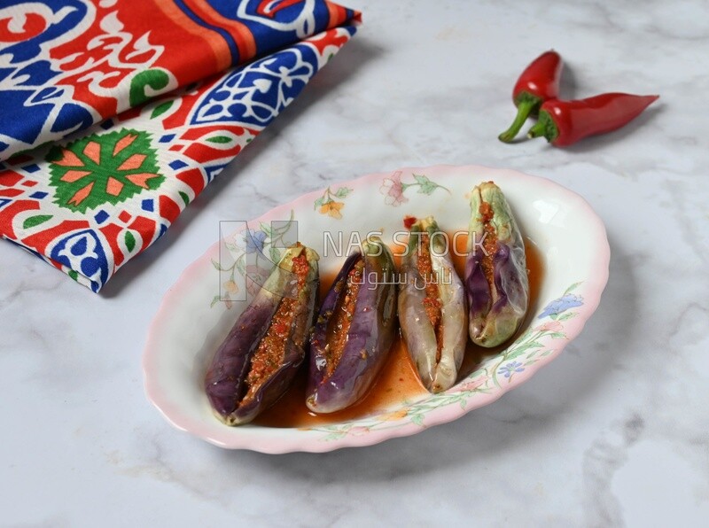 Plate of Pickled eggplant with sauce in it, Egyptian pickles, Arabic restaurants