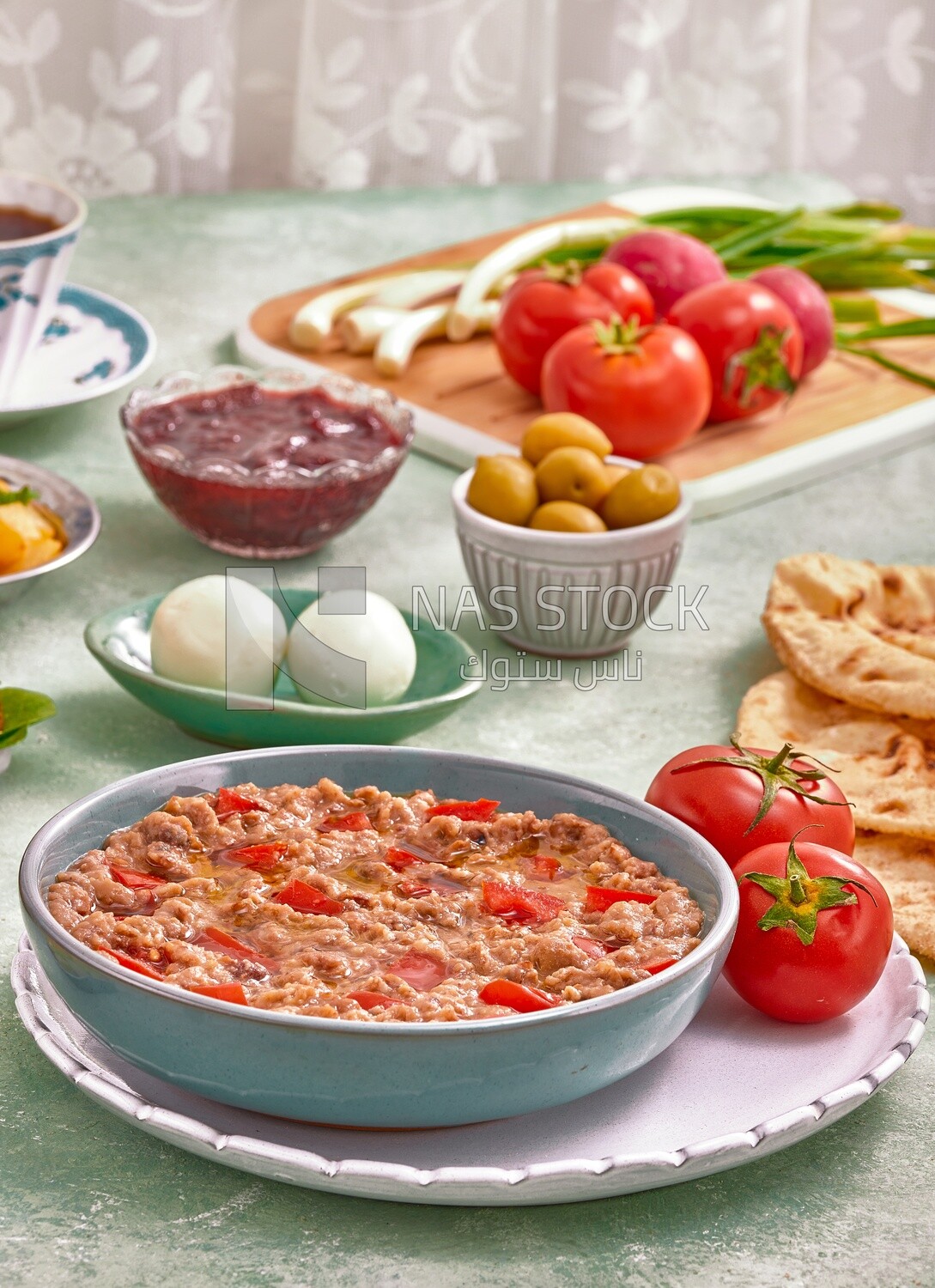 close up of a dish of foul medames with tomato, Arabic breakfast, oriental breakfast, arab restaurant