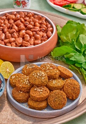 close-up of oriental breakfast, a dish of foul medames, falafel tablets, Arabic breakfast, arab restaurant