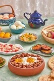 Dish of foul medames with fried egg, cheese with tomato, Arabic breakfast, oriental breakfast, arab restaurant