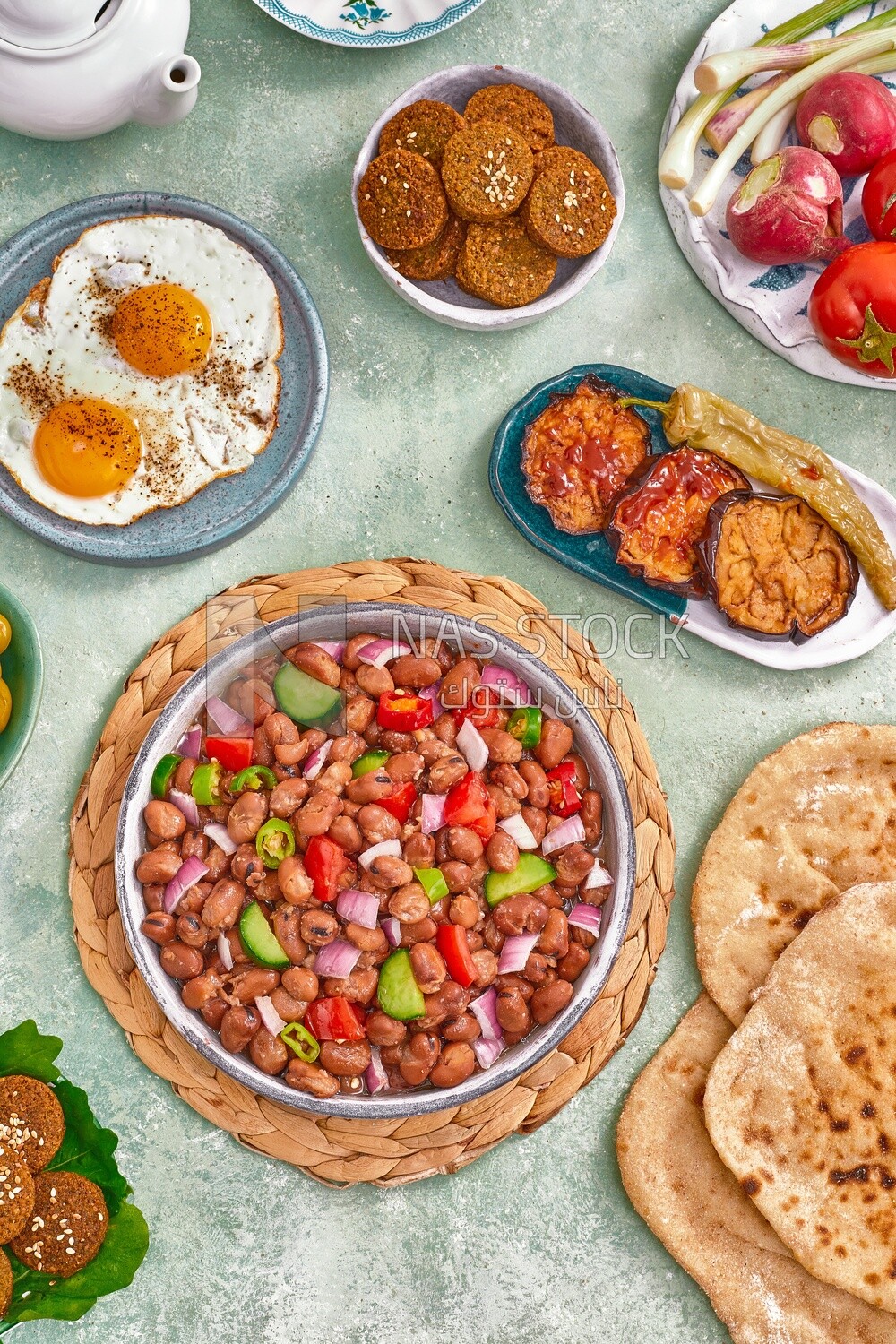 close-up of a dish of foul medames with vegetables, Arabic breakfast, oriental breakfast, arab restaurant