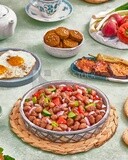 close-up of a dish of foul medames with vegetables, Arabic breakfast, oriental breakfast, arab restaurant