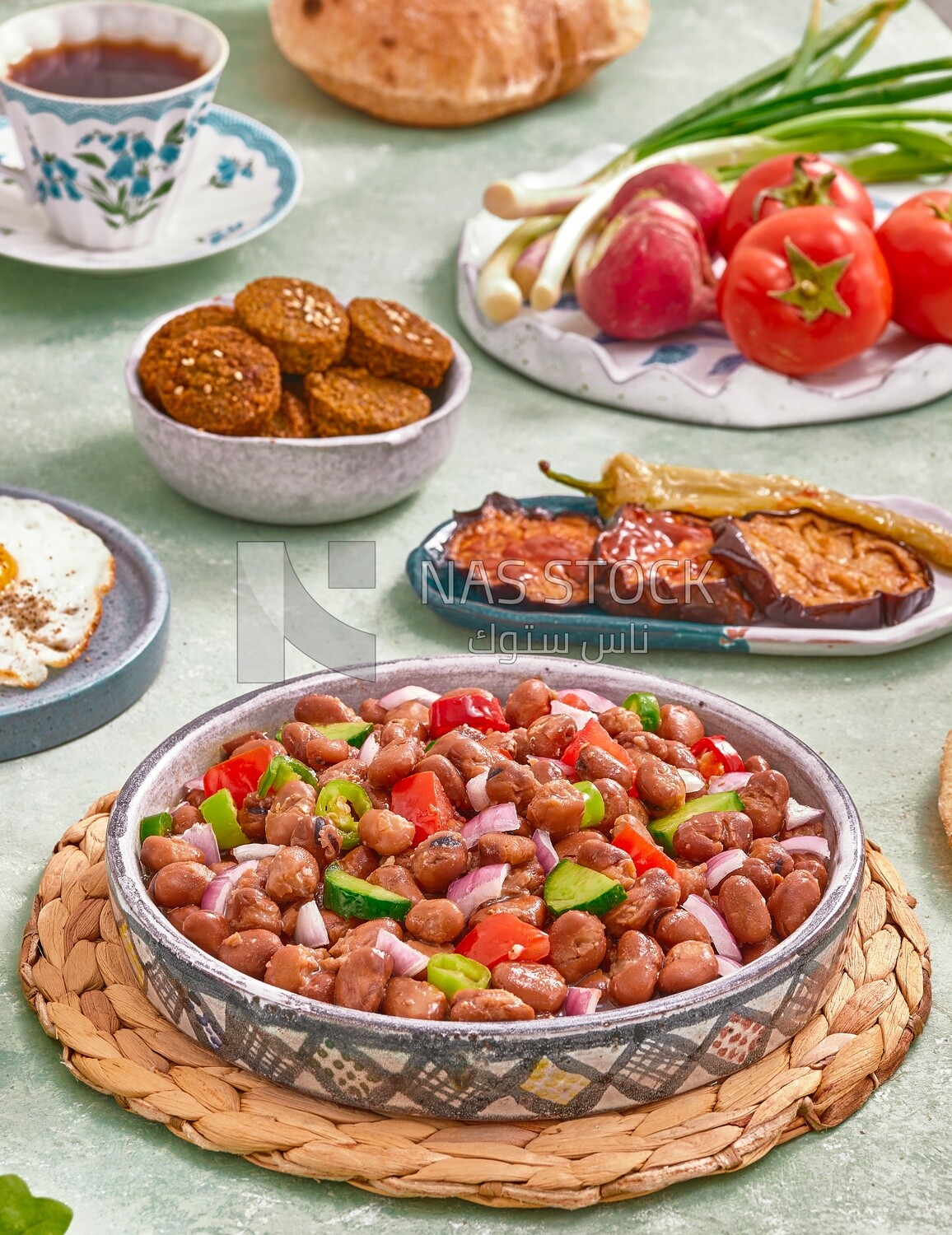 close-up of a dish of foul medames with vegetables, Arabic breakfast, oriental breakfast, arab restaurant