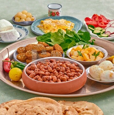 close-up of oriental breakfast, a dish of foul medames, falafel tablets, Arabic breakfast, arab restaurant