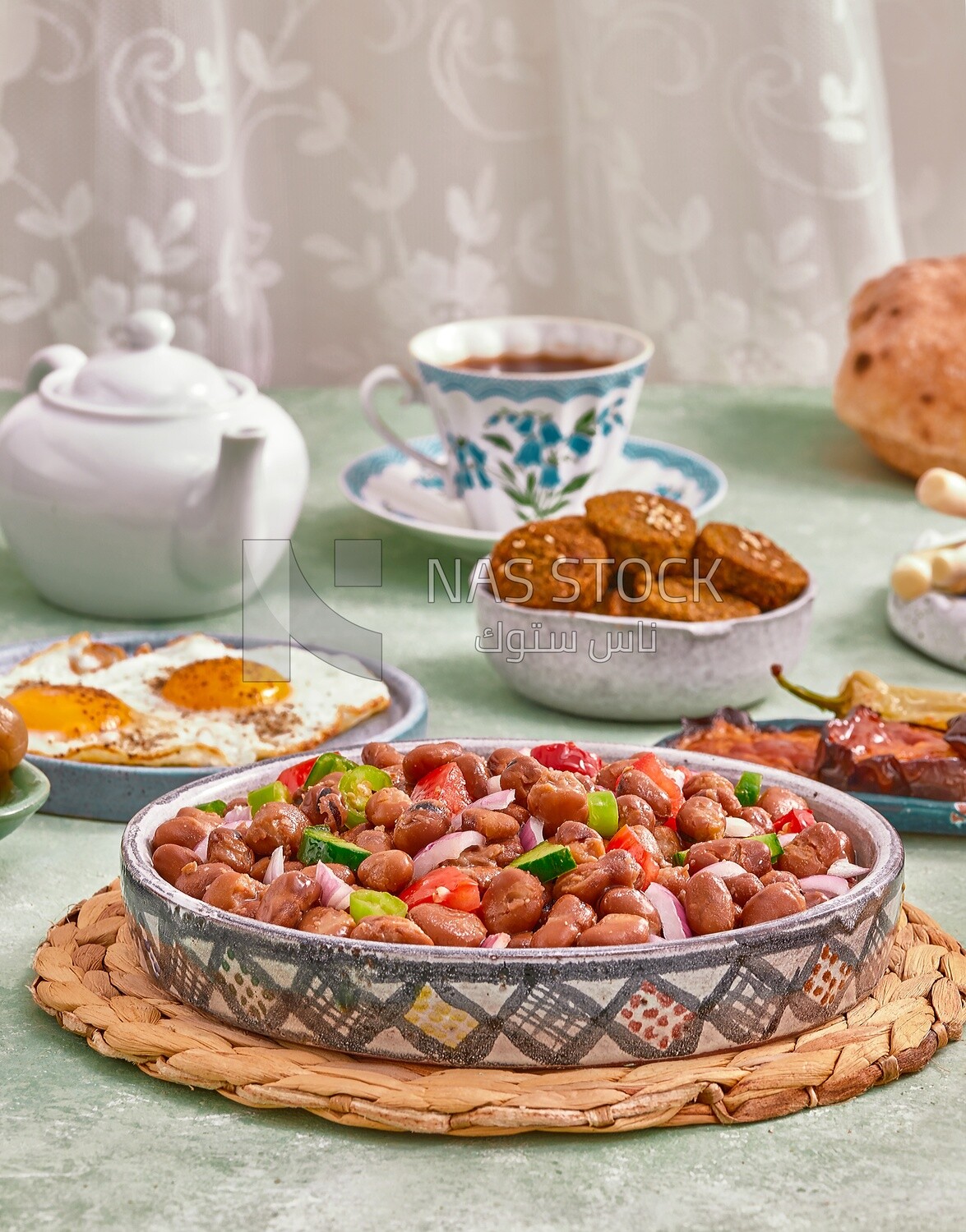 close-up of a dish of foul medames with vegetables, Arabic breakfast, oriental breakfast, arab restaurant