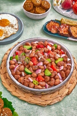close-up of a dish of foul medames with vegetables, Arabic breakfast, oriental breakfast, arab restaurant
