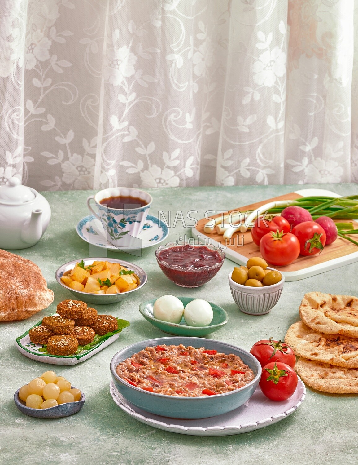 close-up of oriental breakfast, a dish of foul medames with tomato, Boiled egg, falafel tablets, Arabic breakfast, arab restaurant