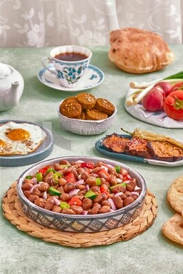 close-up of a dish of foul medames with vegetables, Arabic breakfast, oriental breakfast, arab restaurant