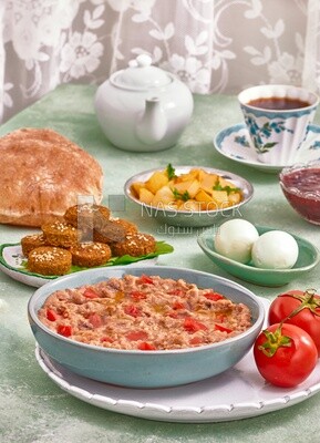 close up of a dish of foul medames with tomato, Arabic breakfast, oriental breakfast, arab restaurant