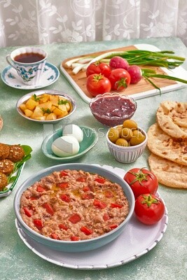 close up of a dish of foul medames with tomato, Arabic breakfast, oriental breakfast, arab restaurant