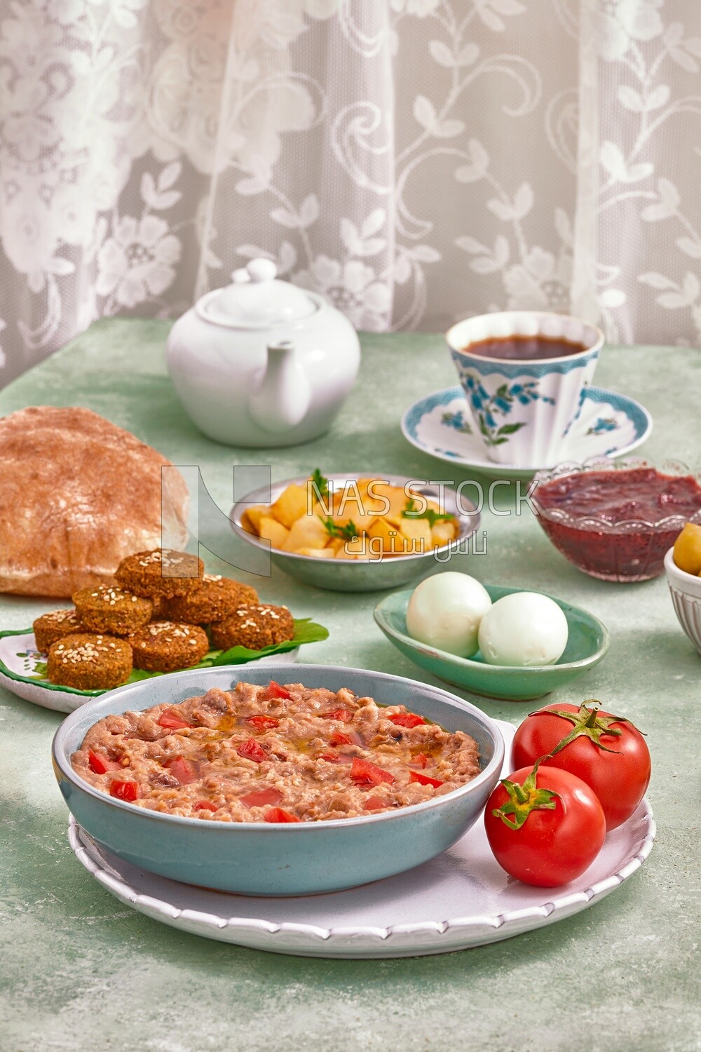 Close up of a dish of foul medames with tomato, Arabic breakfast, oriental breakfast, arab restaurant