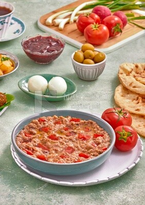close up of a dish of foul medames with tomato, Arabic breakfast, oriental breakfast, arab restaurant