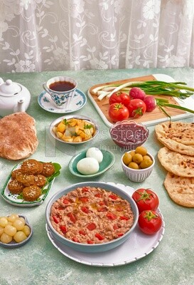 close up of a dish of foul medames with tomato, Arabic breakfast, oriental breakfast, arab restaurant