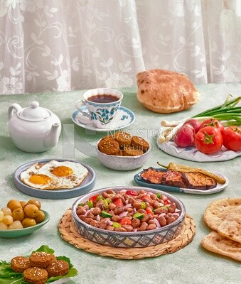 close-up of a dish of foul medames with vegetables, falafel tablets, a plate of fried egg, Arabic breakfast, oriental breakfast, arab restaurant
