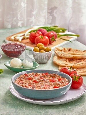 close up of a dish of foul medames with tomato, Arabic breakfast, oriental breakfast, arab restaurant