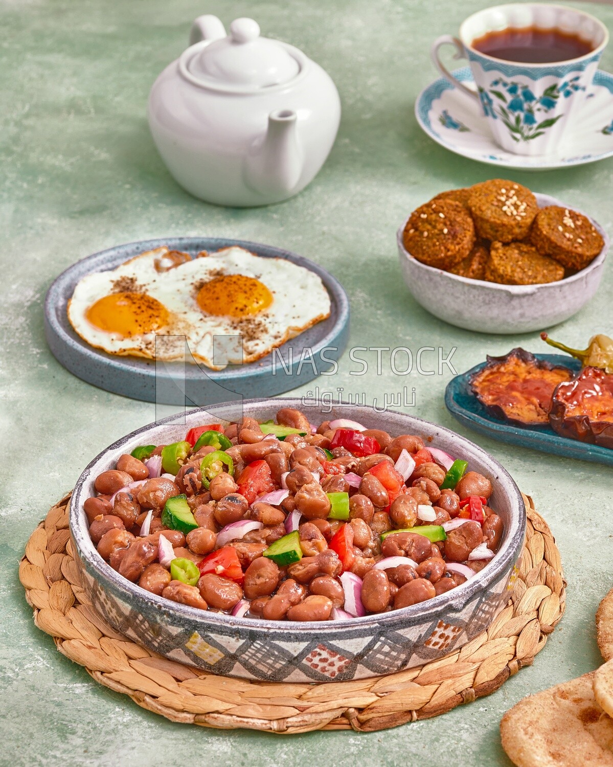 Close-up of a dish of foul medames with vegetables, Arabic breakfast, oriental breakfast, arab restaurant