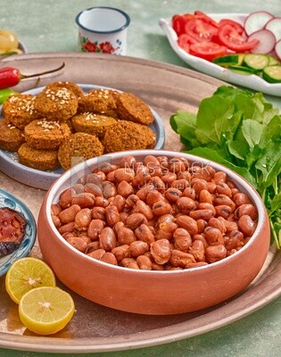 Close-up of oriental breakfast, a dish of foul medames, falafel tablets, Arabic breakfast, arab restaurant