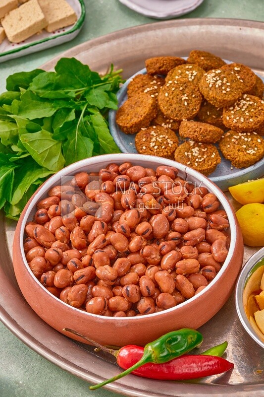 Close-up of oriental breakfast, a dish of foul medames, falafel tablets, Arabic breakfast, arab restaurant