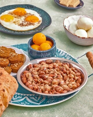 Close-up of oriental breakfast, a dish of foul medames, falafel tablets, Arabic breakfast, arab restaurant