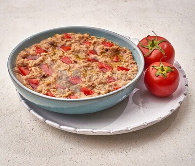 Close-up of oriental breakfast, a dish of foul medames with tomato, Arabic breakfast, arab restaurant