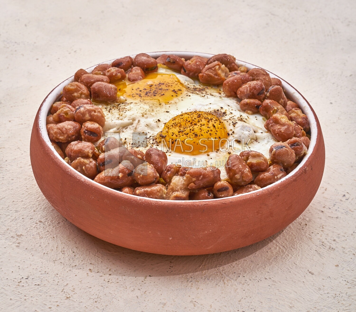 Close-up of oriental breakfast, a dish of foul medames with fried egg, Arabic breakfast, arab restaurant