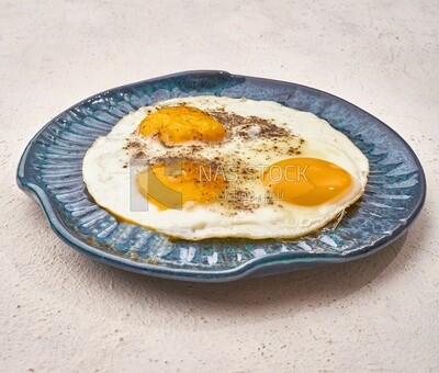 Close-up of a plate of fried egg, Arabic breakfast, oriental breakfast, arab restaurant