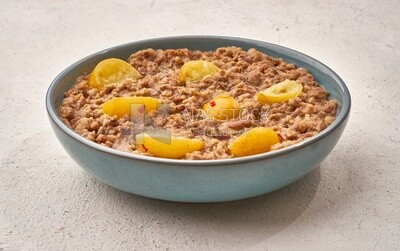 Close-up of oriental breakfast, a dish of foul medames with lemon slices, Arabic breakfast, arab restaurant