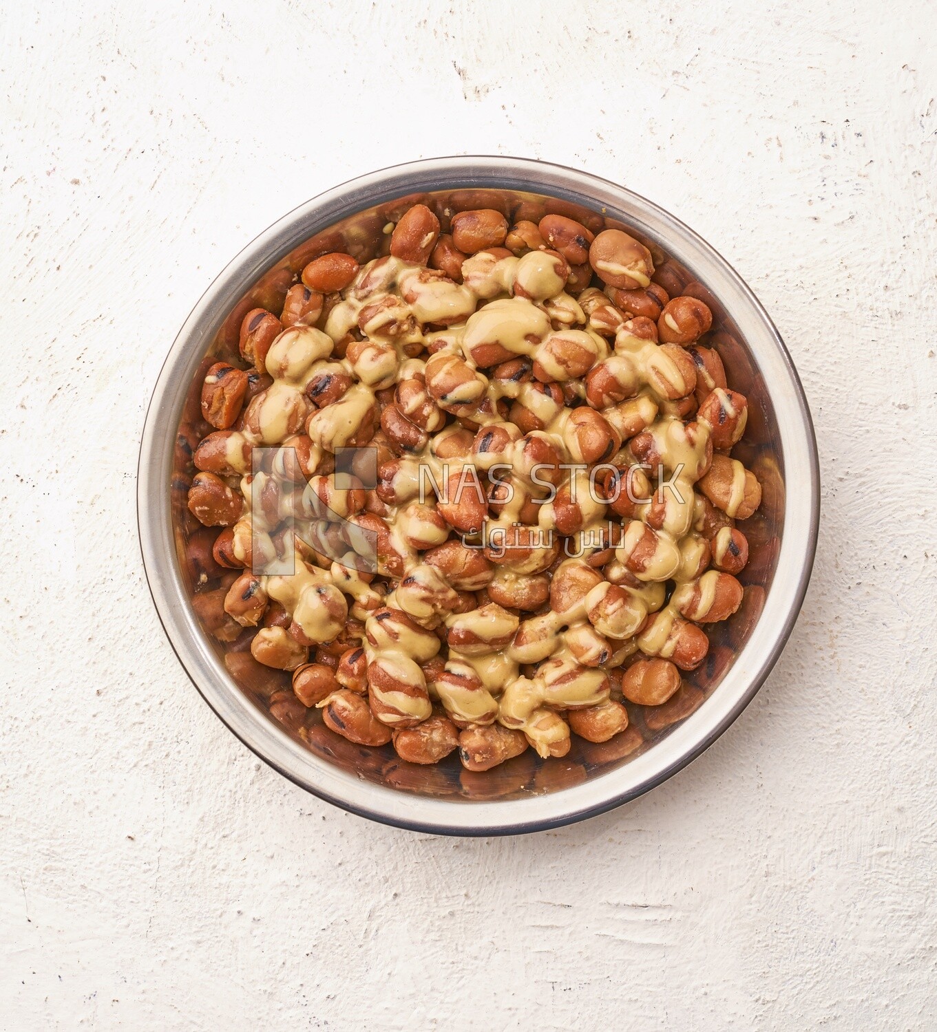 Close-up of oriental breakfast, a dish of foul medames with tahini, Arabic breakfast, arab restaurant