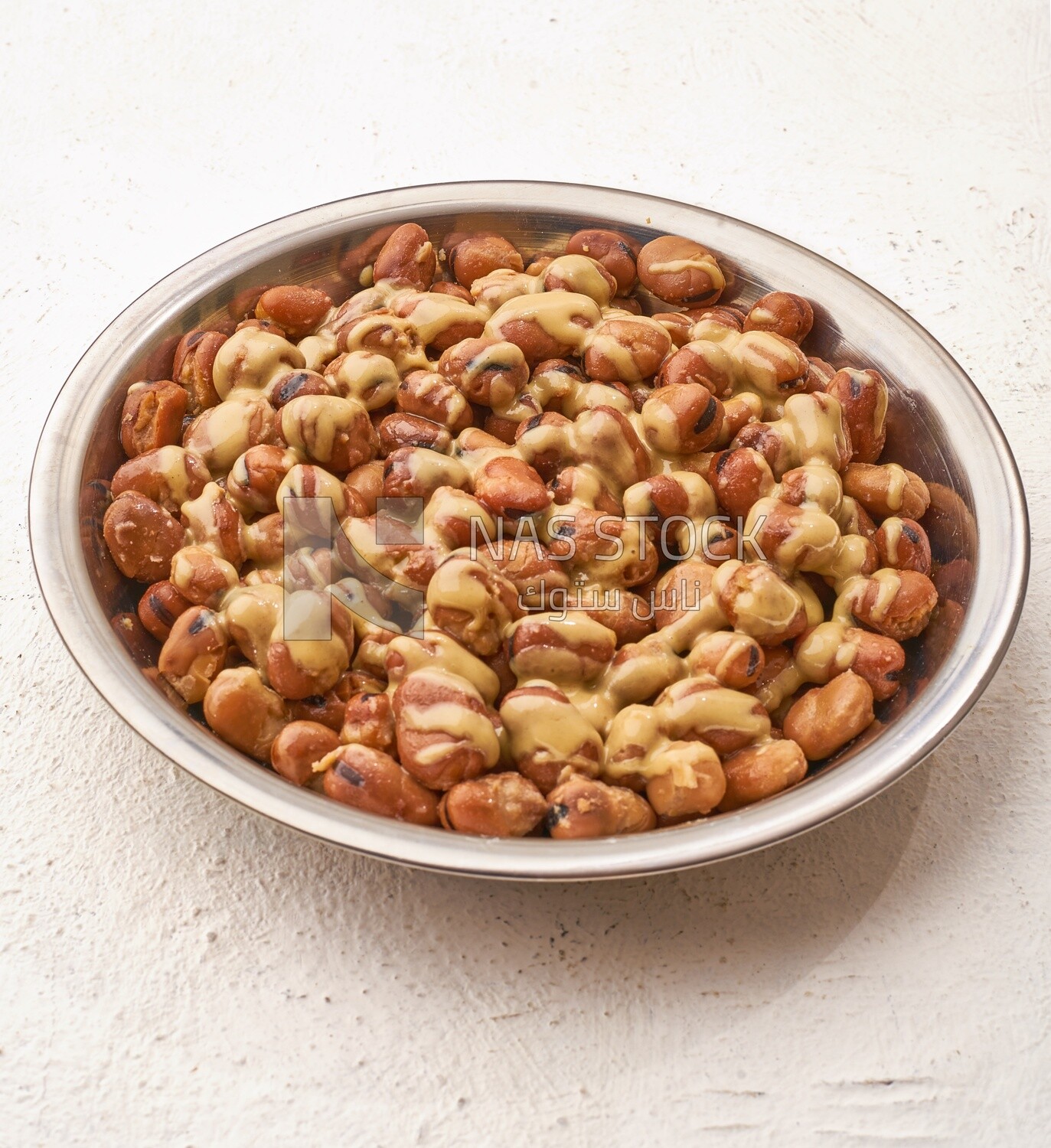 Close-up of oriental breakfast, a dish of foul medames with tahini, Arabic breakfast, arab restaurant