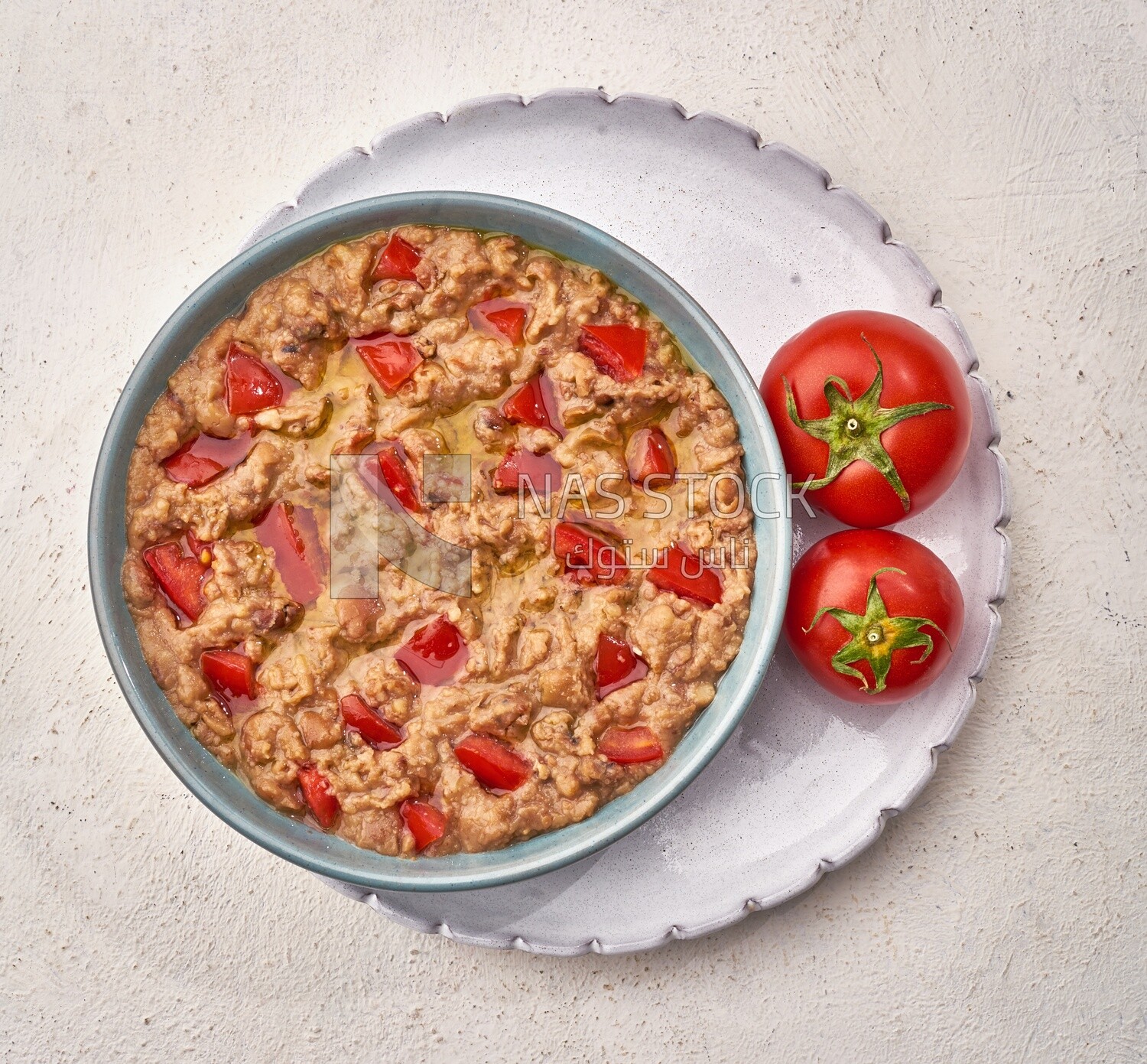 Close-up of oriental breakfast, a dish of foul medames with tomato, Arabic breakfast, arab restaurant