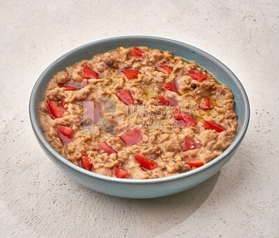 Close-up of oriental breakfast, a dish of foul medames with tomato, Arabic breakfast, arab restaurant