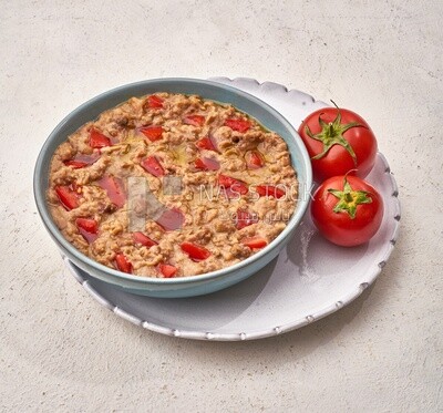 Close-up of oriental breakfast, a dish of foul medames with tomato, Arabic breakfast, arab restaurant