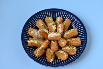 Tulumba with cream in it, eastern sweets, Arabic Restaurant