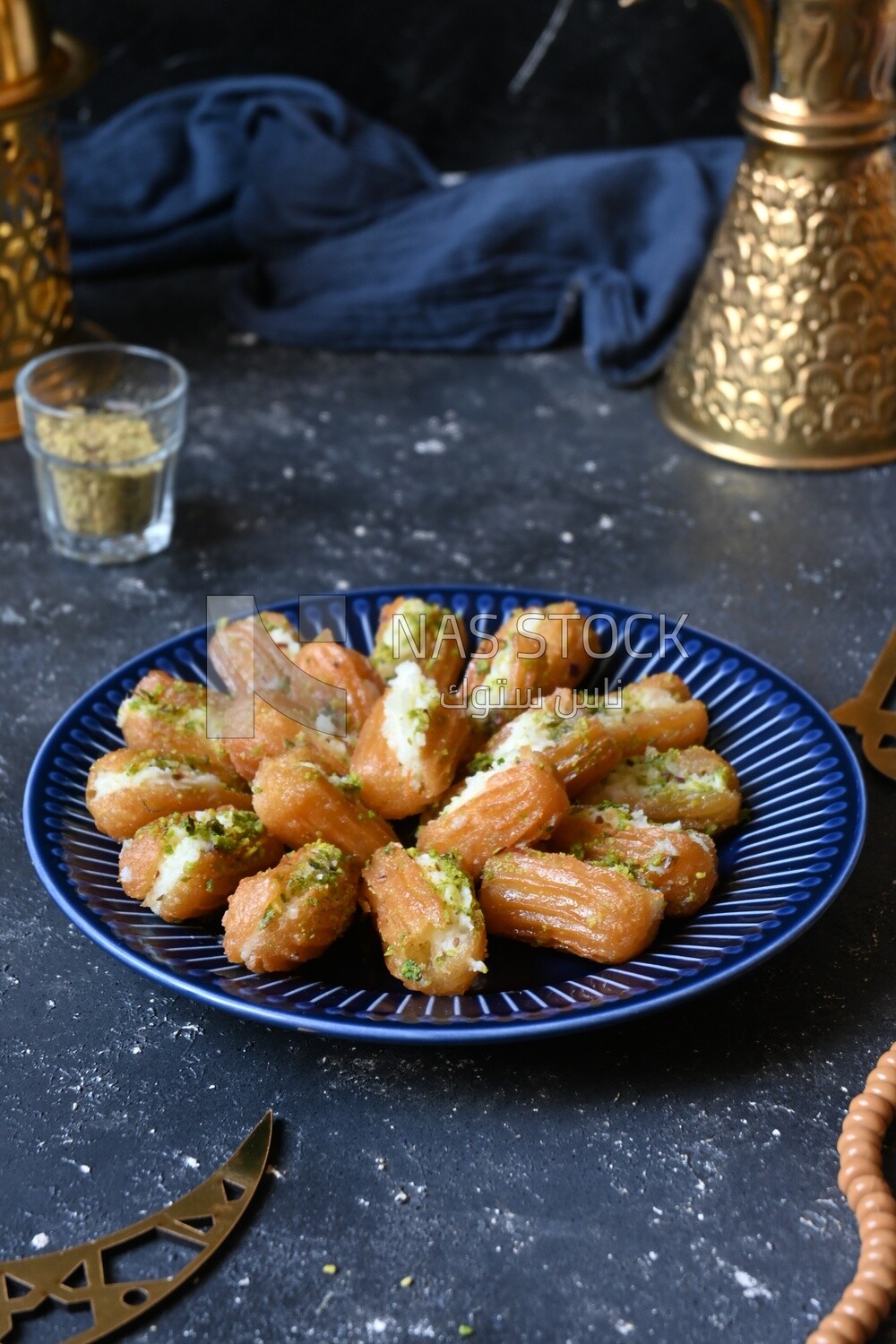Tulumba with cream in it, eastern sweets, Arabic Restaurant