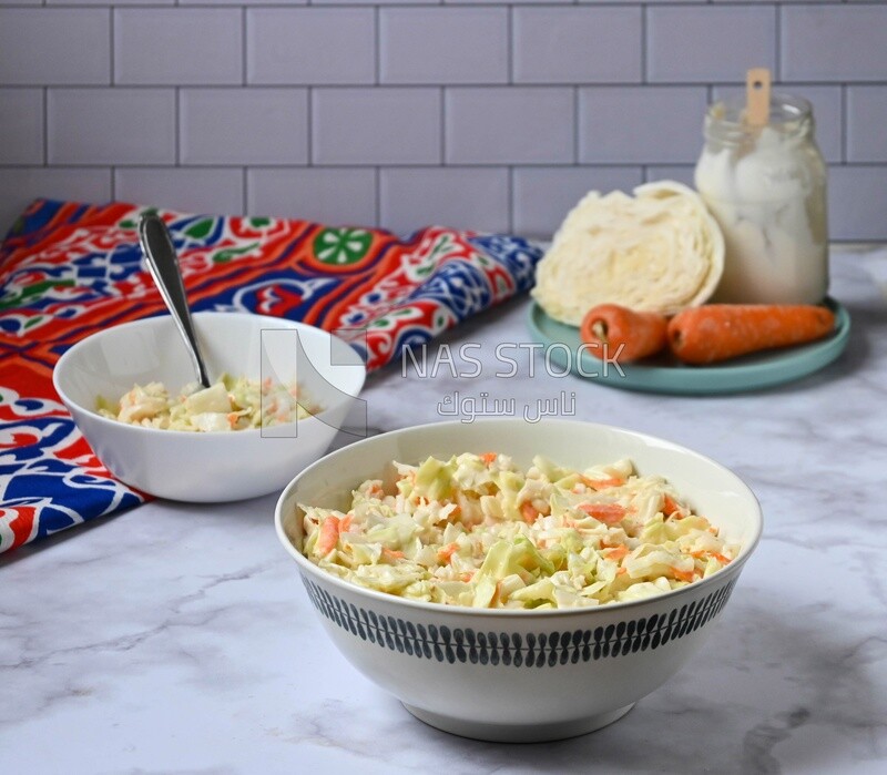 Bowl of Coleslaw beside the ingredients​ of it, cold appetizers, Arabic dishes, oriental foods