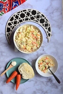 Bowl of Coleslaw beside the ingredients​ of it, cold appetizers, Arabic dishes, oriental foods