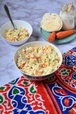 Bowl of Coleslaw beside the ingredients​ of it, cold appetizers, Arabic dishes, oriental foods