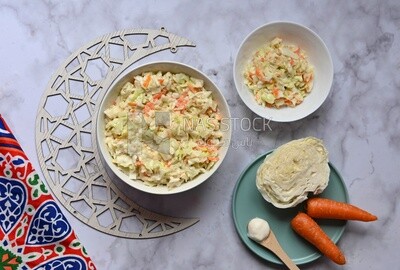 Bowl of Coleslaw beside the ingredients​ of it, cold appetizers, Arabic dishes, oriental foods