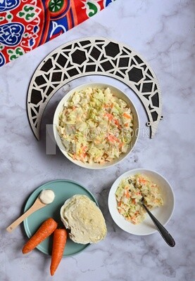 Bowl of Coleslaw beside the ingredients​ of it, cold appetizers, Arabic dishes, oriental foods