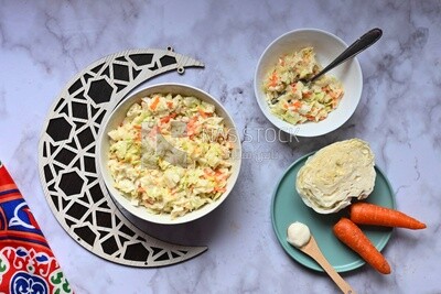 Bowl of Coleslaw beside the ingredients​ of it, cold appetizers, Arabic dishes, oriental foods