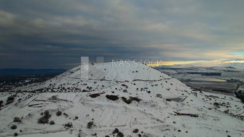 Drone footage of the Majdal Shams village on a snowy day, landscape waterfall, tourism in Palestine