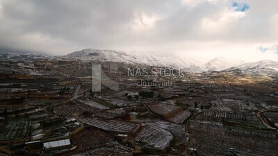 Drone footage of the Majdal Shams village on a snowy day, landscape waterfall, tourism in Palestine